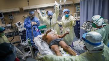 AP Exclusive: ER staff saves lives, suffers in hot spot