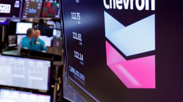 Chevron turns a profit but warns of pain ahead