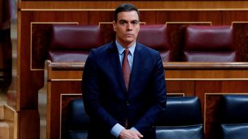 Spain averts political crisis, extends virus lockdown