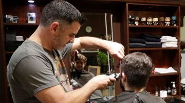 New Zealand barber snips away at midnight as nation reopens