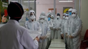 Turkey's pandemic strategy hinges on hazmat-suited gumshoes