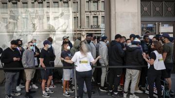 'We've missed it': Long lines form outside shops in England