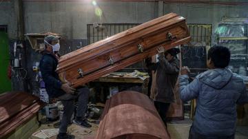Chileans mass produce caskets to deal with COVID onslaught