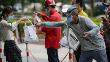 The Latest: Thailand to let in laborers to ease shortage