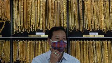 Uncertainty pushes gold price to record $1,926 per ounce
