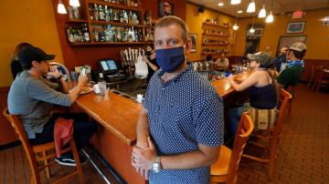 Struggling merchants, insurers battle over pandemic coverage