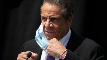 Cuomo takes over governors group as virus batters states
