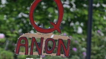 Facebook says it will ban groups for 'representing' QAnon