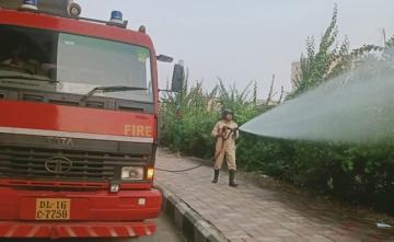 Firemen Sprinkle Water On Delhi Roads To Battle Capital's Air Pollution