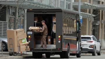 With brown trucks everywhere, UPS delivers again in 3Q
