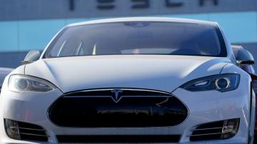 Tesla will be added to the benchmark S&P 500 index Dec. 21