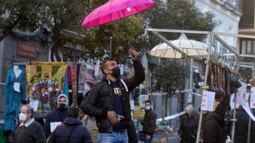 Ancient Madrid market reopens amid debate over virus rules