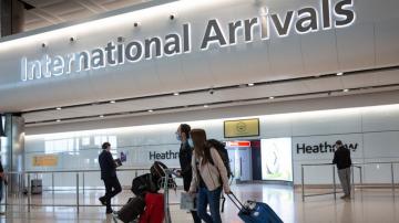 England to cut travel quarantines to 5 days with tests