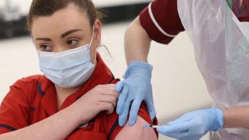 The Latest: Britain rolling out 1st COVID-19 vaccine doses