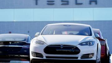 High-flying Tesla joins S&P 500; skeptics say buyer beware