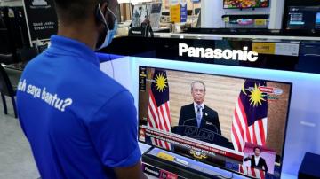 Malaysia under virus emergency in reprieve for embattled PM