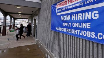 US jobless claims decline to a still-high 900,000