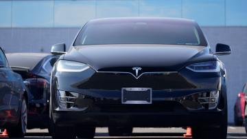 Tesla fights pandemic, rides sales jump to 1st annual profit