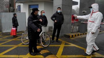WHO team in Wuhan visits provincial disease control center
