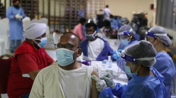 In Dubai's COVID vaccine scramble, Sikhs serve doses to all