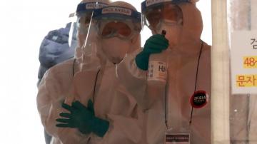 The Latest: WHO team: Coronavirus likely jumped to humans