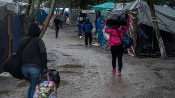 Tents ice over as freezing weather plagues migrants near US border