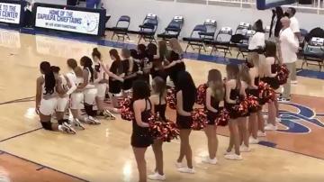 Announcer calls girls' basketball team racial slur as players kneel during anthem