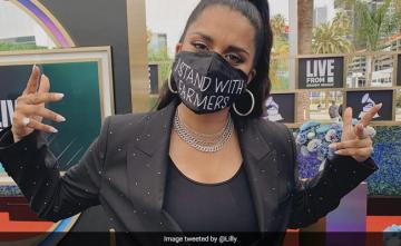 Lilly Singh Wears "I Stand With Farmers" Mask To The Grammys