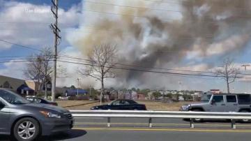 'Devastating' wildfire intentionally set, authorities say