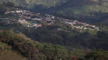Colombian town uses discipline, speakers to stay virus-free