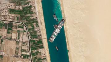 Container ship stuck in Suez Canal 'partially refloated'
