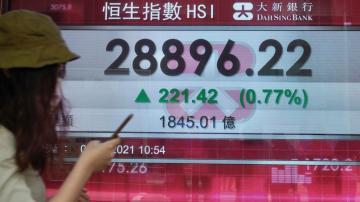 Asian shares mostly higher; Tokyo slips as virus cases surge