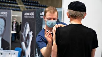 Danes vaccinate 100,000 people in a day to test system