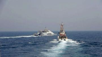 US warship fires warning shots at Iranian small boats