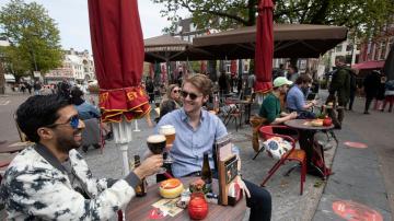 Guests flock to Dutch cafe terraces as lockdown eases