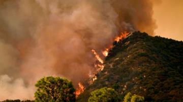 Suspected arsonist sought in LA County wildland fire threatening homes