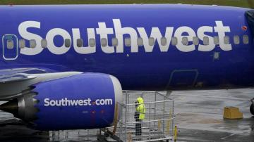Woman charged with assaulting Southwest flight attendant