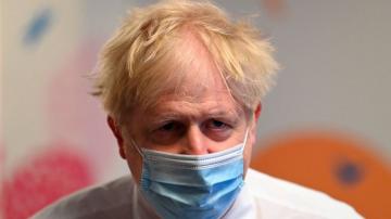 Boris Johnson defends virus record after ex-aide's attack