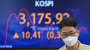 Asian shares mostly higher on upbeat US jobs, growth data