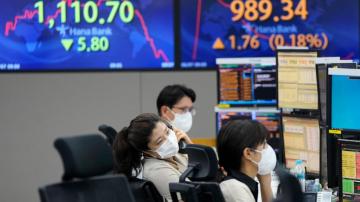Asian shares trading mixed as optimism wears off on US rally