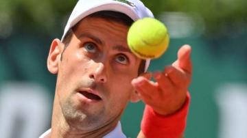 French Open 2021: Novak Djokovic survives scare to beat Lorenzo Musetti and reach quarter-finals