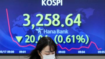 Asian stocks mixed after Wall St falls on Fed rate hike hint