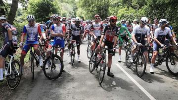 Spectator arrested for causing massive Tour de France crash