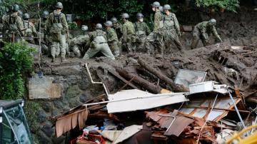 Japan searches for dozens missing in resort town mudslide