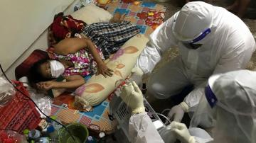 AP PHOTOS: Volunteers aid COVID ill in stressed Thai capital