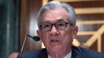 Fed notes improving economy, a step toward easing support