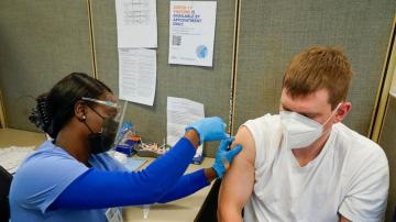States race to use COVID-19 vaccines before they expire