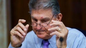 Democratic senator urges Fed to begin trimming bond buys