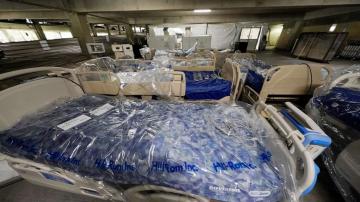 Field hospital opens in parking garage as state sees crush of COVID patients
