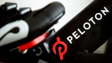 Peloton stock skids as company posts loss, cuts bike price